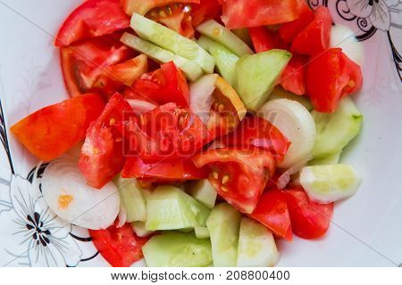 Tomato cucumber salad inside the trough Azerbaijani salad