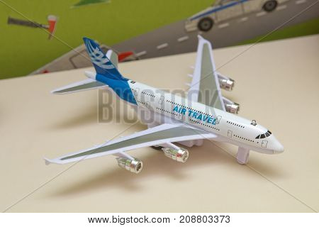 White airplane toys in the background without focus