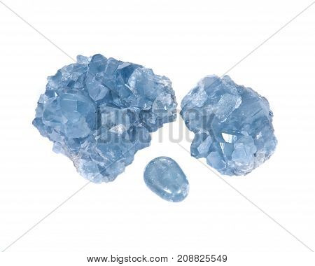 Blue celestite cluster and polished celestite palm stone isolated on white background