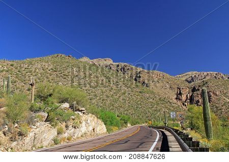Road leading up Mount Lemmon in Tucson, Arizona, USA in the Santa Catalina Mountains located in the Coronado National Forest with blue sky copy space.