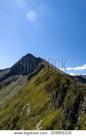 On the graukogel, Gastein mountains, Austria, Europe. Futuristic looking viewpoint and iron bridge for visitors and hikers.