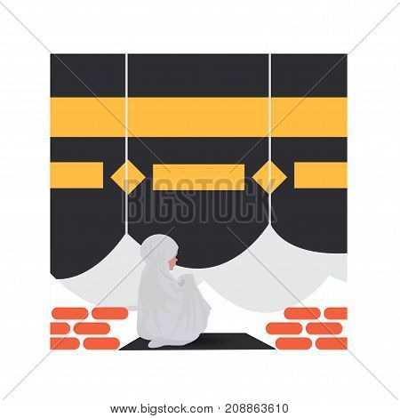 Beautiful muslim young woman praying at Kaaba, Mecca, Saudi Arabia