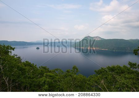 Mount Kamui and the beautiful clear blue Lake Mashu, Hokkaido, Japan
