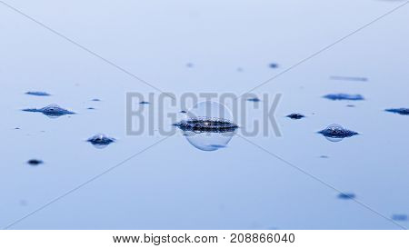 air bubbles on the surface of the water