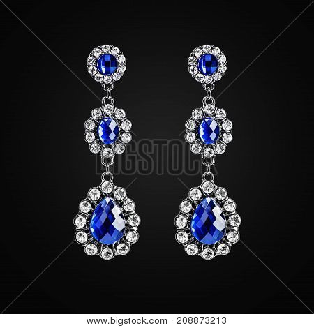 Silver earrings with jewels isolated on the black