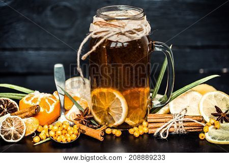 The Composition Of Tea With Lemon On A Black Background