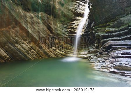 Large deep grotto with a flowing beautiful waterfall