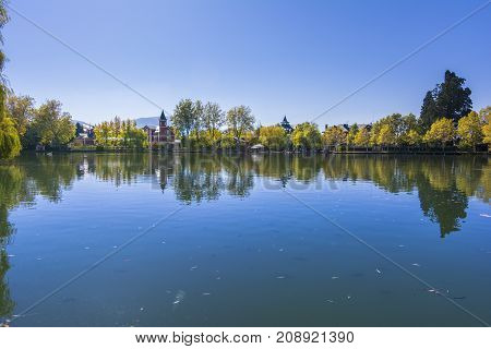Autumn colors and reflection on Puigcerda's pond in Pyrenees. Located in north Catalonia, Spain.