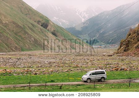 Truso Gorge, Georgia - May 21, 2016: Mitsubishi Delica Space Gear on country road in summer mountains landscape. Delica is a range of trucks and multi-purpose vehicles produced by Mitsubishi Motors.
