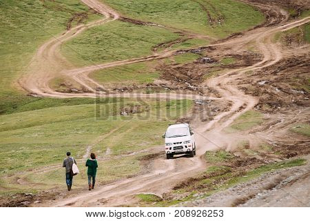 Stepantsminda Gergeti, Georgia - May 23, 2016: Mitsubishi Delica Space Gear on country road in summer mountains landscape. Delica is a range of trucks and multi-purpose vehicles produced by Mitsubishi Motors.