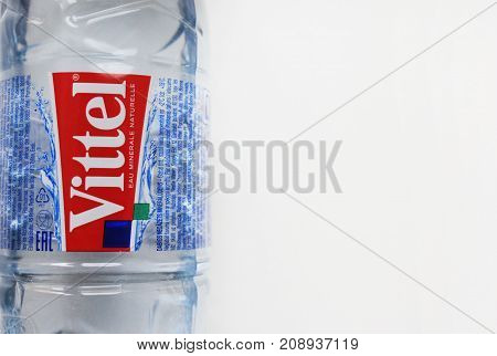 MOSCOW, RUSSIA - OCTOBER 9, 2017: Vittel Mineral Water in Plastic Bottle. Vittel is a French brand of bottled water popular worldwide. Bottle of water isolated on empty white copy space background.