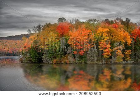 Ricker pond in Vermont with fall foliage