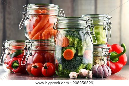 Jars With Marinated Food And Organic Raw Vegetables