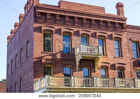 Vintage Multi Story Brick Building In Early Morning