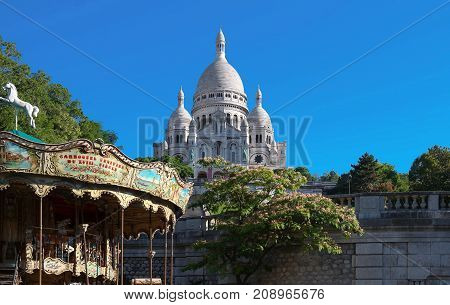 The basilica Sacre Coeur is a Roman catholic church located at the summet of the butte Montmartre , the highest point in Paris.