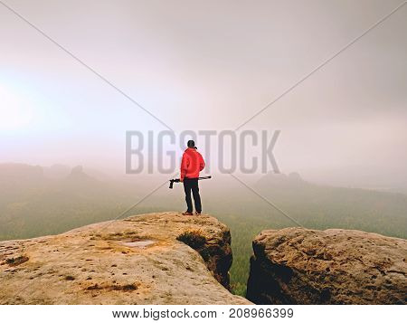 Nature Photographer Prepare Camera To Takes Impressive Photos Of Misty Fall Mountains. Tourist Photo