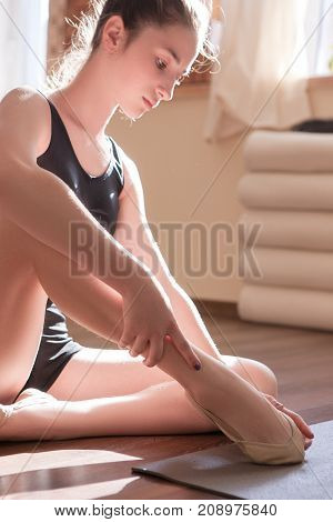 Young ballerinas lesson. Body problem. Delicate sport kind, girl in dance class in focus on foreground. Sensibility from childhood, gym background, ballet concept