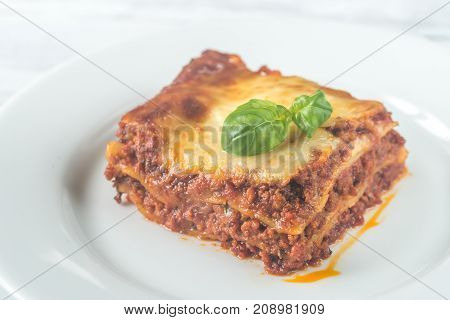 Portion Of Lasagne On The Wooden Table