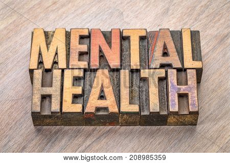 mental health -word abstract in vintage wood letterpress printing blocks
