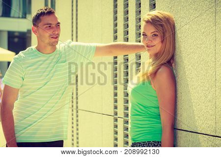 Man Flirting With Girl On City Street