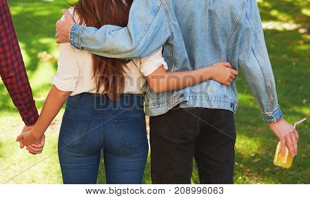 Friendship love jealousy adultery polygamy concept. Love triangle. Young woman in relationship with two men.