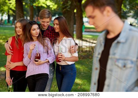Jealousy and envy in friends relationship. One macho man dating with all women on the party. Seduction secrets, pickup, alpha male concept
