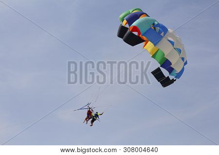 Paraglider With A Saddle For People. Parasales - Water Parachutes. Bright Colours.