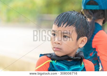 Two Asian Siblings In Playing Together In Water Aqua Park Pool.