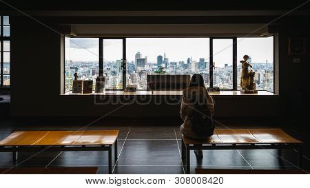 Kobe, Hyogo, Japan - November 22, 2018: Woman Sit And Watch Aerial View Of City In Old Building Of K