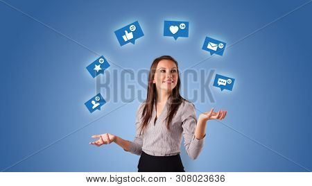 Young person playing with social media symbols