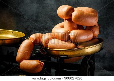 Big Bunch Of Raw Short Thick Wieners Rolled In Spiral On Scales