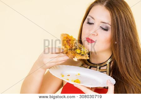 Young Woman Eating Hot Fresh Pizza Slice. Delicious Fast Food Meal. People, Italian Cuisine Concept.
