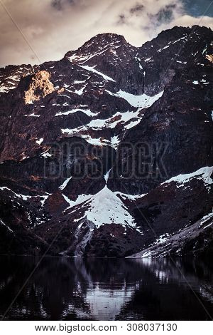 Spectacular View To The Beautiful Mountains With Mirroed Reflection And Clouds At Sunrise Time.