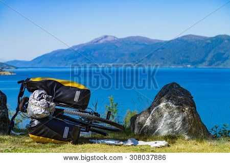 Mountain Bicycle With Attached Bag Saddlebag Against Nature, Mountains Fjord Landscape In Norway