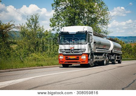 France - May 14, 2014: Fast Driving Mercedes Benz Actros With Geodis Bm Tanker Transporting Liquids 