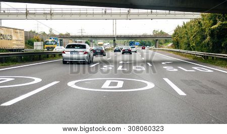 Germany - Sep 27, 2013: Driver Pov At Front Driving Cars And D, Slo From Slovenia Sign Direction On 