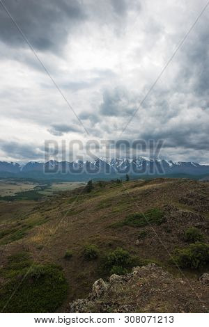 Summer in Kurai steppe and North-Chui ridge of Altai mountains, Russia. Cloud day.