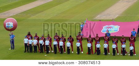 A general view as the teams line up for the national anthems MANCHESTER, ENGLAND. 22 JUNE 2019:   The West Indies v New Zealand, ICC Cricket World Cup match, at Old Trafford, Manchester, England. 