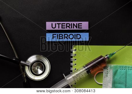 Uterine Fibroid On Top View Black Table With Blood Sample And Healthcare/medical Concept.