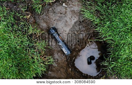 Sprinkler System Under Maintenance Repair With Parts Laying On Ground