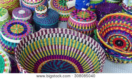Wicker Colored Baskets Made From Toquilla Straw, Vegetable Fiber, And Painted With Various Colors At