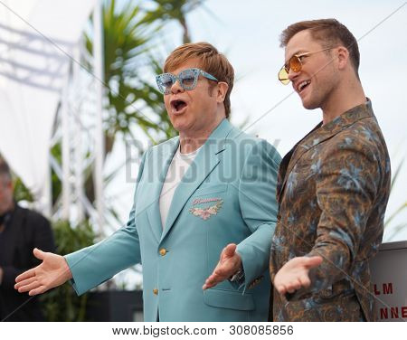 CANNES, FRANCE - MAY 16, 2019: Elton John and ActorTaron Egerton  attend  the photocall for 