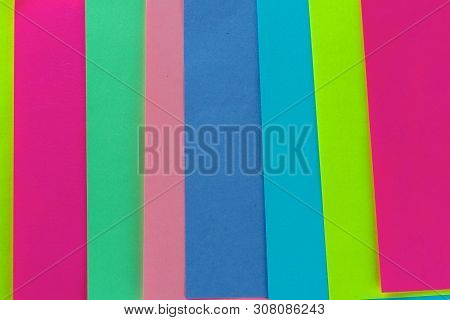 Blue, Pink, Yellow, Purple, Green Neon Paper Color For Background. Striped Geometric Pattern Of Brig