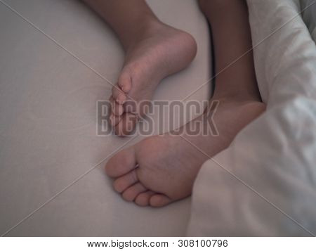 Baby Feet Sleeping On The Babys Bed