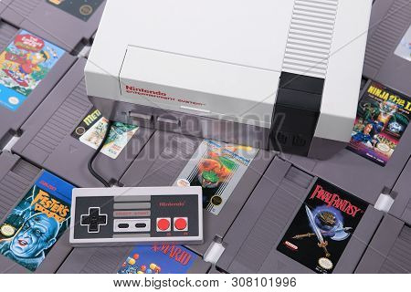 Taipei, Taiwan - June 19, 2019: A Nintendo Nes Mini System And Controller On Top Of A Pile Of Retro 