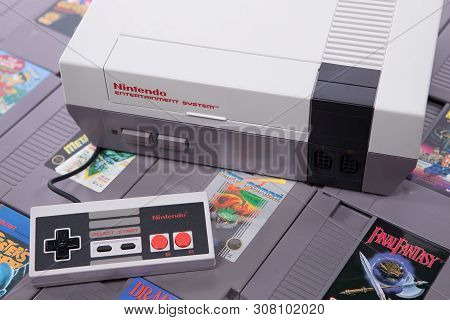 Taipei, Taiwan - June 19, 2019: A Nintendo Nes Mini System And Controller On Top Of A Pile Of Retro 