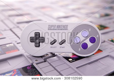 Taipei, Taiwan - June 19, 2019: A Nintendo Nes Mini System And Controller On Top Of A Pile Of Retro 