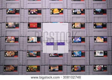 Taipei, Taiwan - June 19, 2019: A Nintendo Nes Mini System And Controller On Top Of A Pile Of Retro 