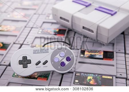 Taipei, Taiwan - June 19, 2019: A Nintendo Nes Mini System And Controller On Top Of A Pile Of Retro 