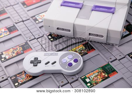Taipei, Taiwan - June 19, 2019: A Nintendo Nes Mini System And Controller On Top Of A Pile Of Retro 